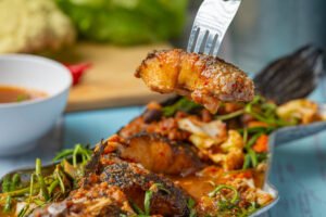 sour curry with snakehead fish, spicy garden hot pot, thai food.